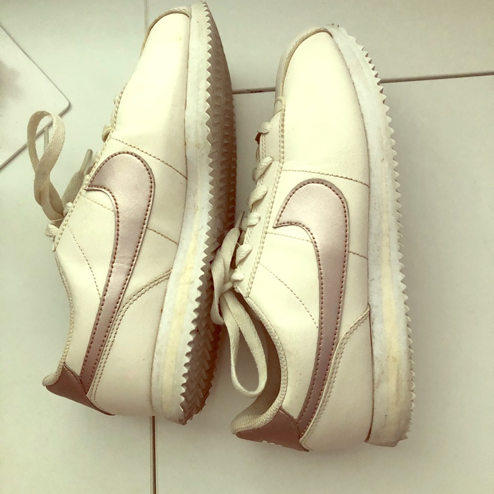 Nike rose gold and cream colored Nike’s